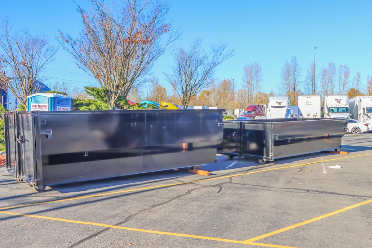 Professional dumpster rental service with roll-off container on residential driveway in Sunbury